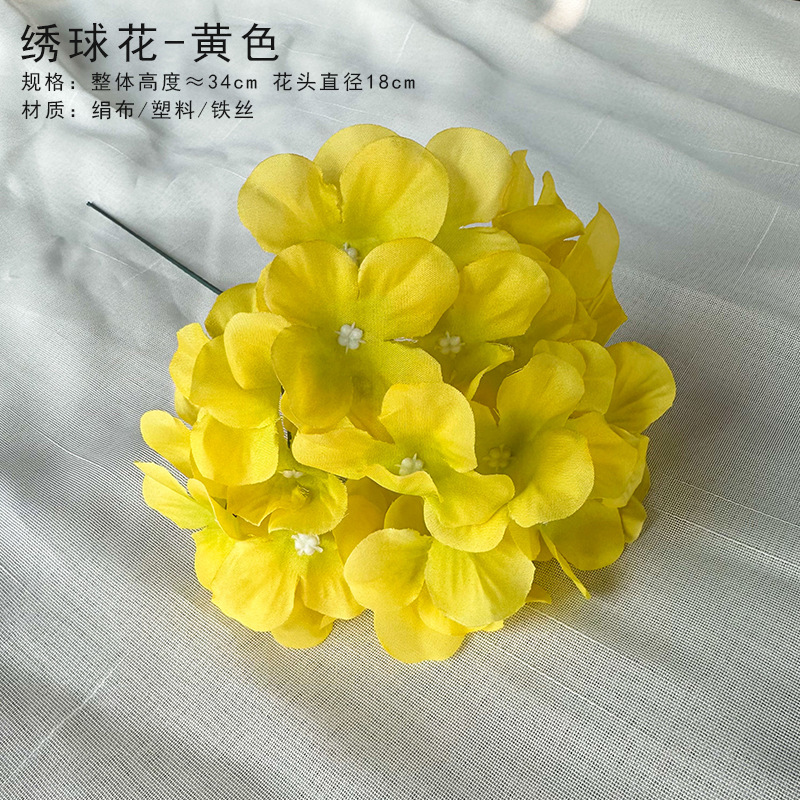 Yellow hydrangea head with rod (not inserted)