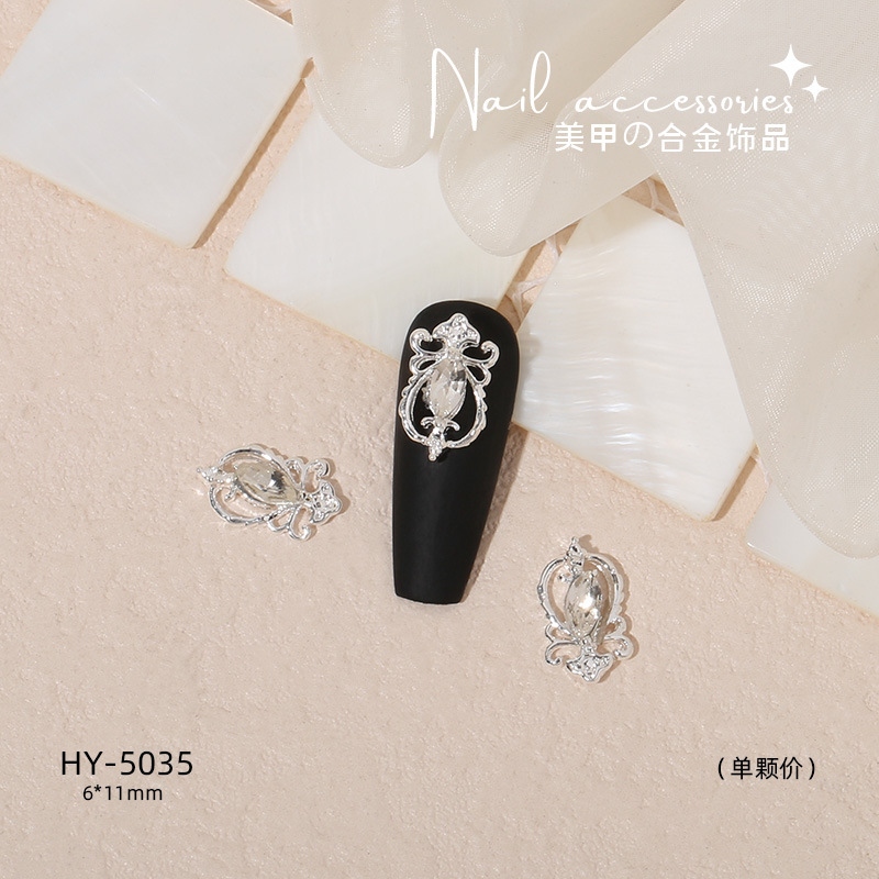 Nuevo arco de uñas amor aleación decoración de uñas flor de la luna mariposa clavo taladro fábrica joyería al por mayor