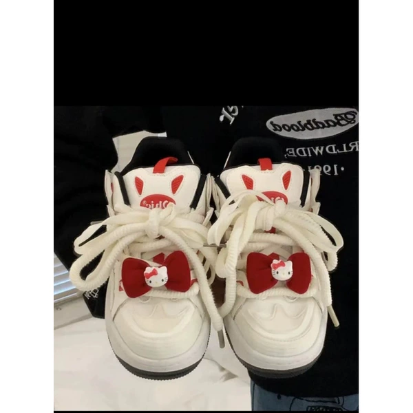 Red footwear with bow