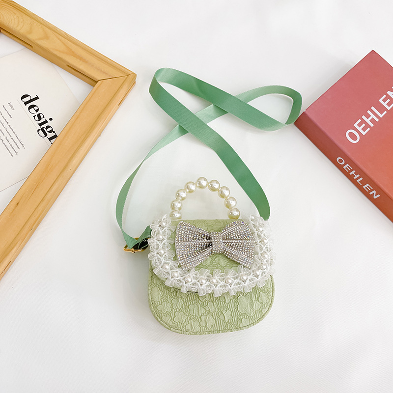 Bolsa de Niños de estilo coreano lindo arco perla Bolso pequeño princesa estilo occidental desgaste a juego joyería bolsa crossbody bolsa