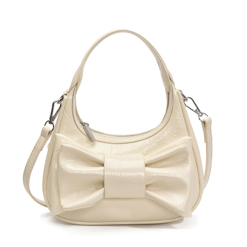 Bolso de moda coreano 2025 verano nuevo bolso femenino de alta calidad textura bolso de hombro lindo lazo bolso de mensajero