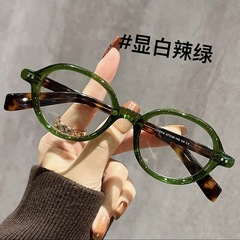 新型の本のオタクのべっこう色の小さい枠のメガネの日本の復古の楕円の青い光のメガネのフレームの鏡の足の老花のファッション