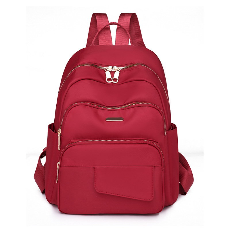 2024 nueva mochila casual de nailon de color sólido para mujer, mochila de viaje de gran capacidad para viajes al aire libre simple y de moda