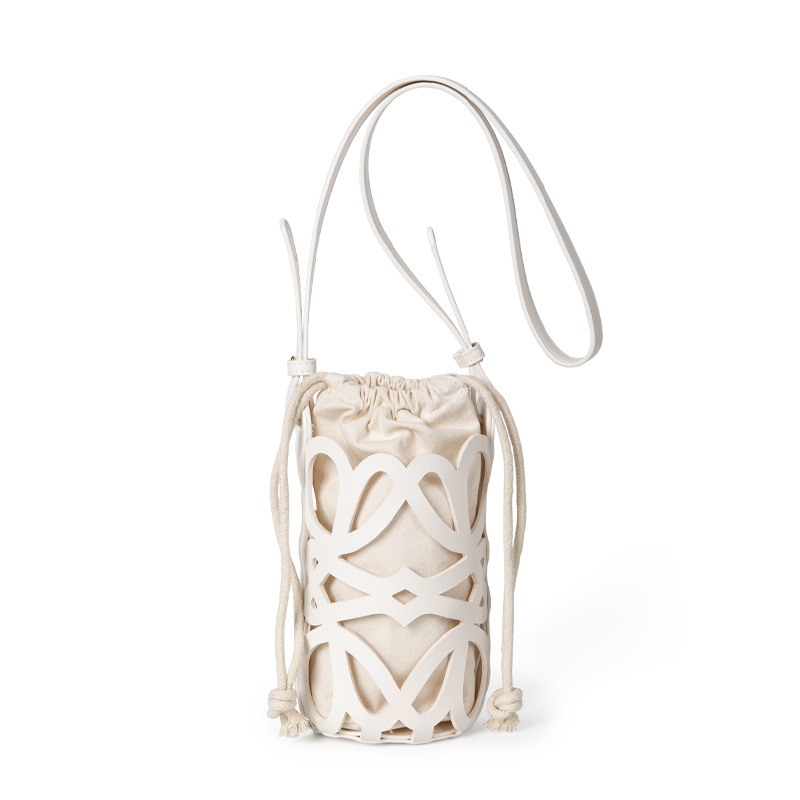 Bolso de mujer 2022 nuevo diseño de nicho hueco cordón lienzo cilindro pequeño bolso personalizado retro crossbody bolso de hombro