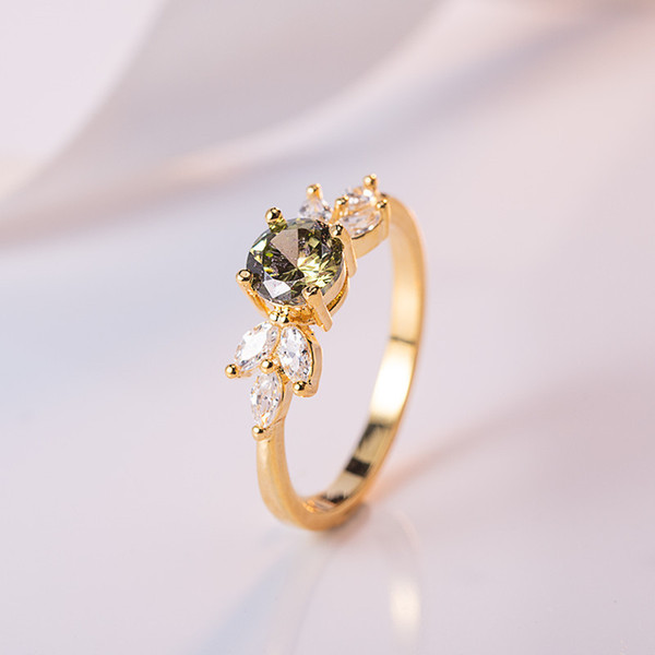 Golden ring with zircon