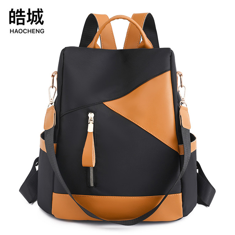 Comercio exterior al por mayor 2023 nueva mochila antirrobo casual para mujer moda contraste color viaje al aire libre mochila de doble uso marea