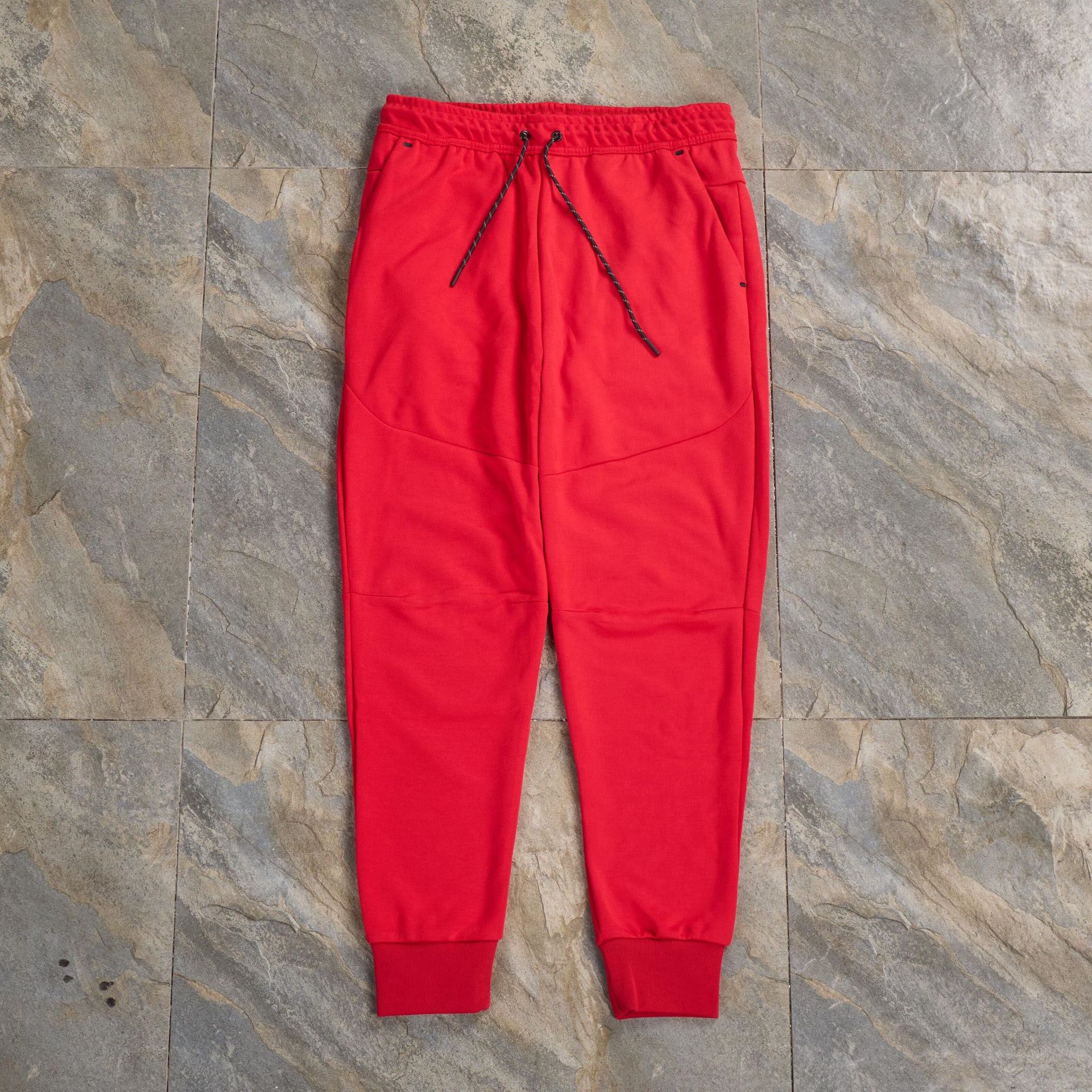 Pantalones casuales deportivos primavera y otoño aire laminado de algodón con cremallera pantalones deportivos para hombres y mujeres