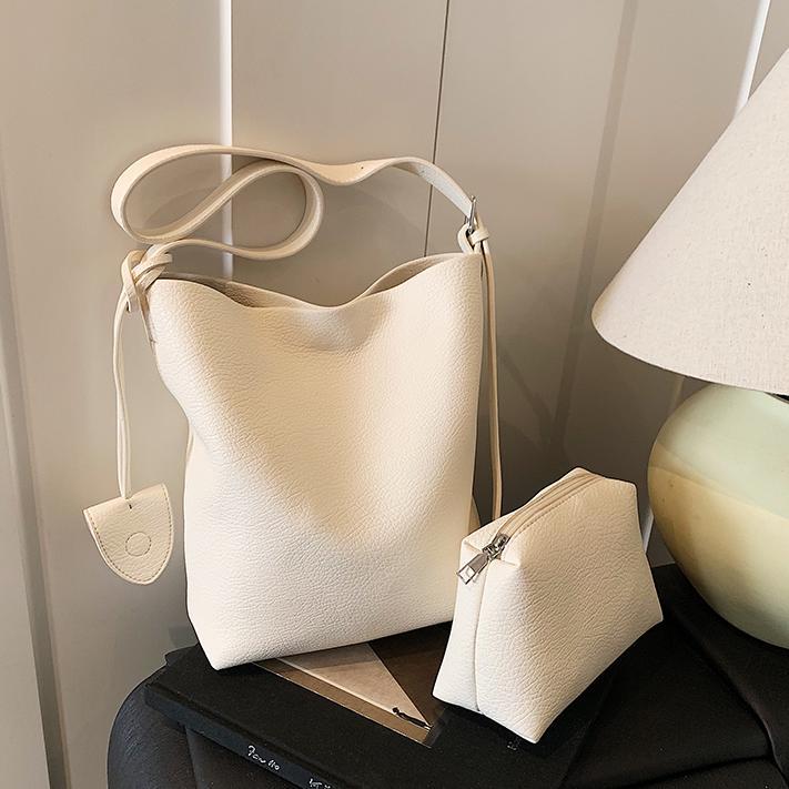 Bolso de cubo de mano de moda de comercio exterior para mujer 2025 nuevo bolso de hombro simple de venta caliente versión coreana bolso casual de alta gama