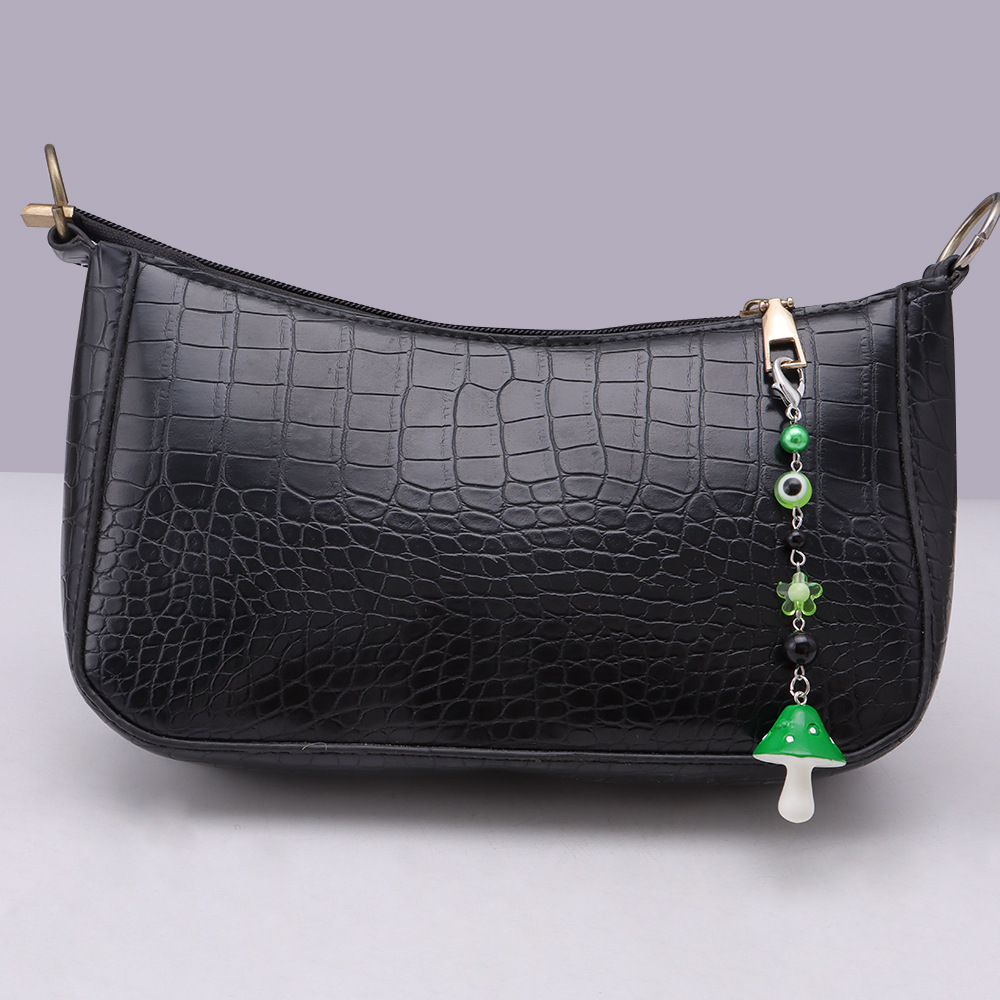 La versión coreana transfronteriza de la joyería de llavero de setas de color, la resina de dibujos animados, el ojo creativo del diablo, el bolso, el colgante de accesorios