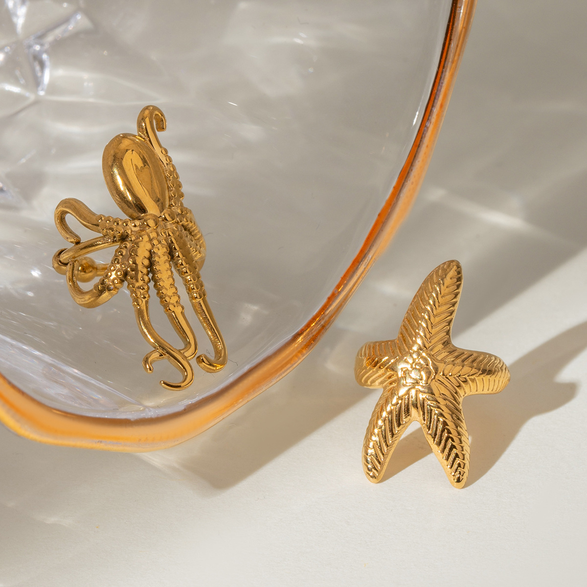 Wanxing Europa y América de acero inoxidable estrellas de mar clips de hueso de orejas de nicho de alta calidad pendientes de titanio joyas de orejas de acero pendientes transfronterizos