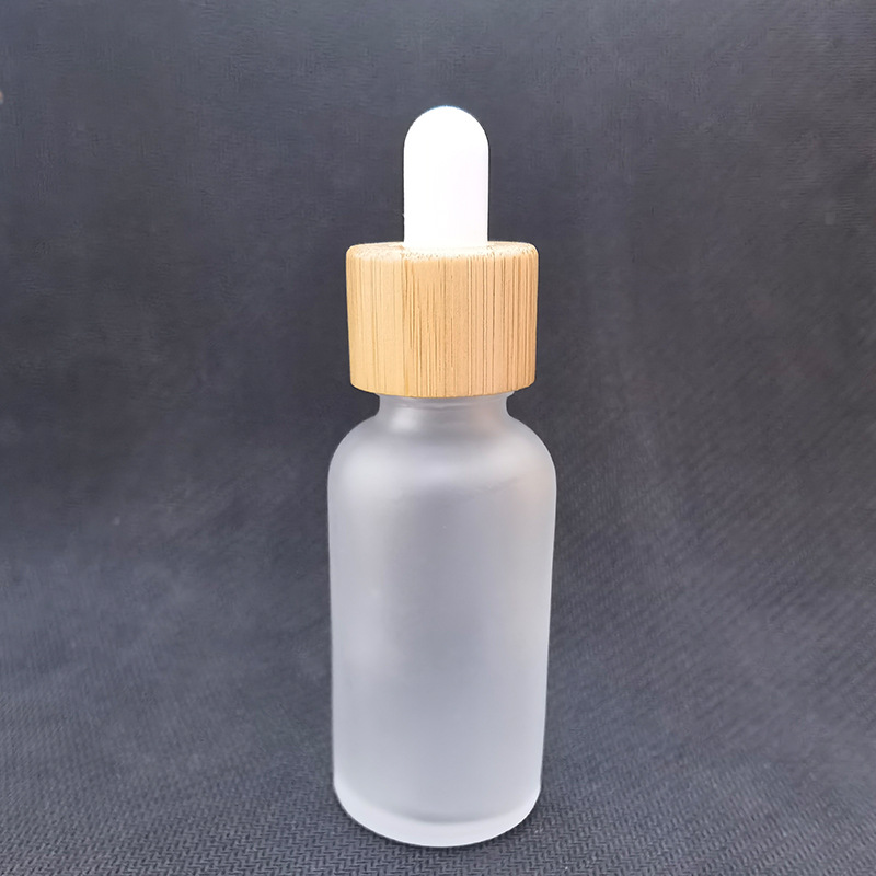 Cubierta de madera de bambú botella cosmética botella sub-botella esencia botella cuidado de la piel Paquete de envases de vidrio esmerilado botella cuentagotas botella de aceite esencial