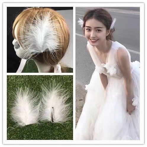 한 쌍의 간단한 흰색 깃털 머리핀