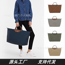 新款龙镶手提袋轻便旅行包大容量尼龙防水饺子包手提包牛皮行李包