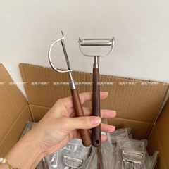 304ステンレス鋼の皮むきナイフくるみの木の柄の削り刀の皮むき器の果物の神器の家庭用台所の多機能の削り子