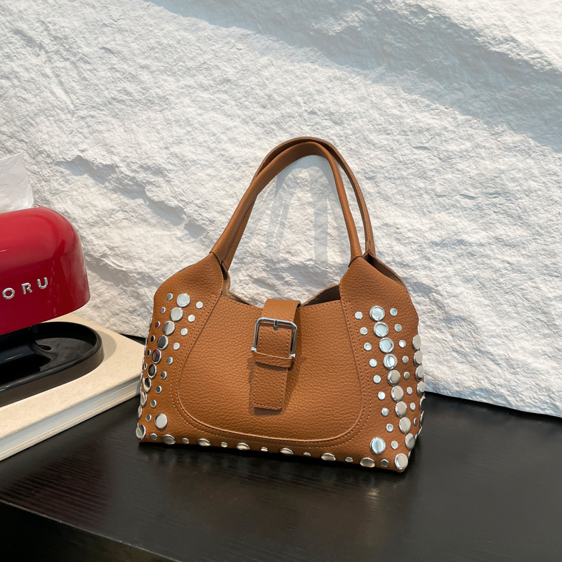 Bolso de axila con textura transfronteriza 2025 primavera y verano nuevo bolso femenino bolso retro con patrón de lichi bolso de hombro con remaches personalizado