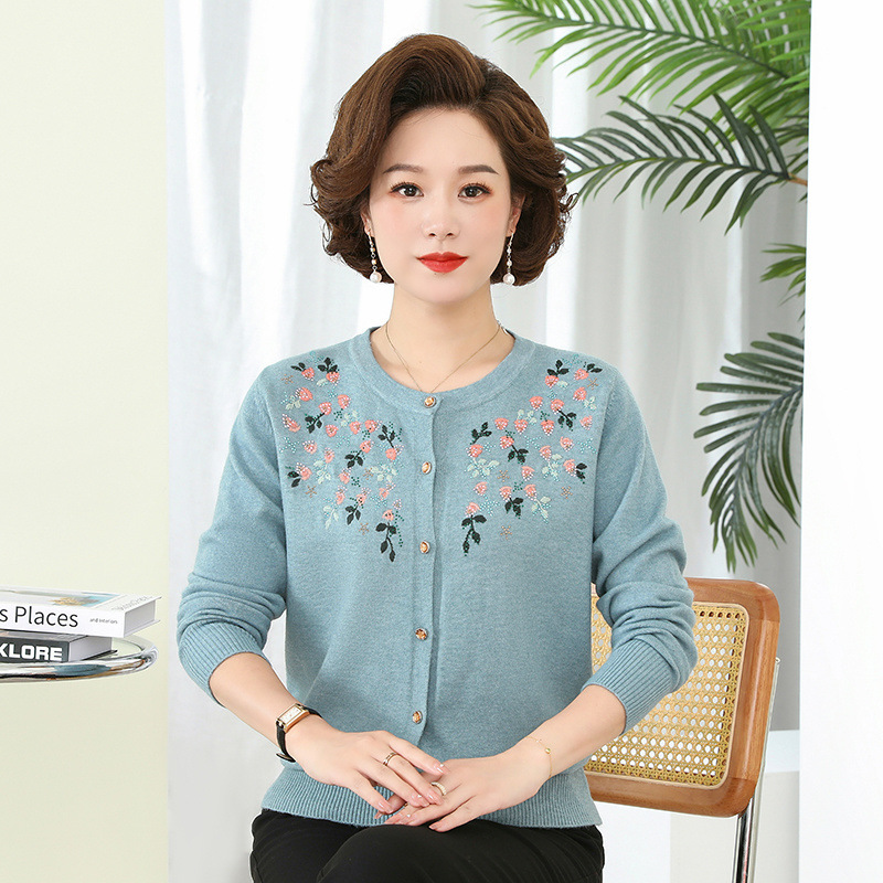 Thin knitted sweater with a round collar