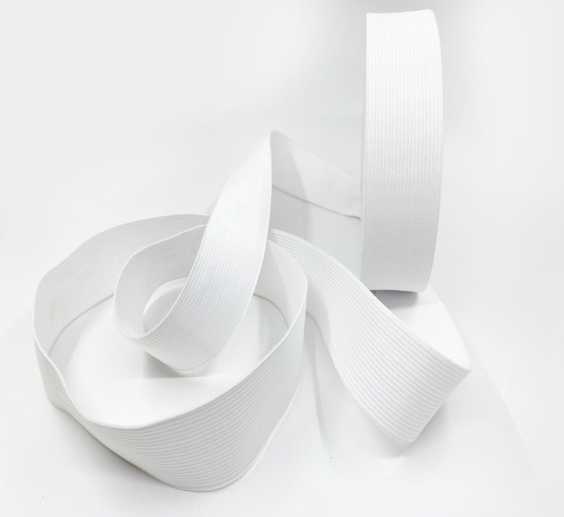 White knitted elastic trousers, wholesale, on elastic band