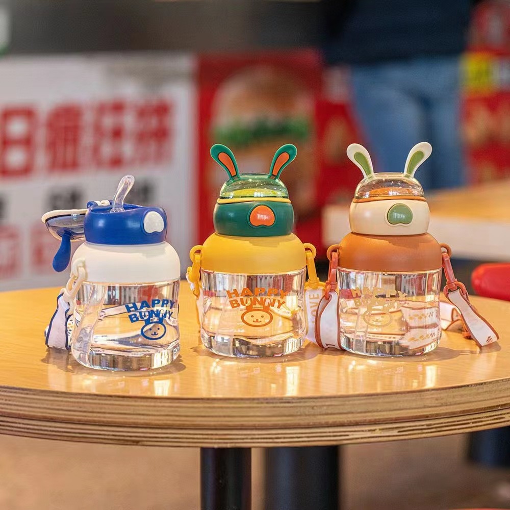 Tianyi 0932 nuevo espacio para niños taza feliz Orejas de conejo taza de plástico transparente Correa al aire libre paja taza de plástico