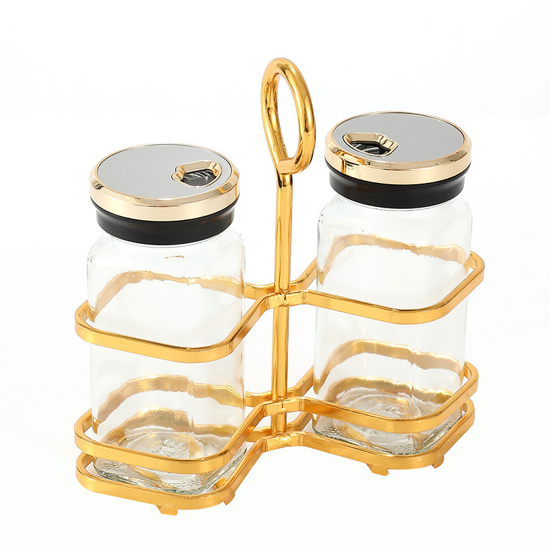 Tarro de condimento de vidrio transparente al por mayor, suministros de cocina, tarro de condimento de sal MSG, juego de botella de condimento creativo de lujo ligero para el hogar