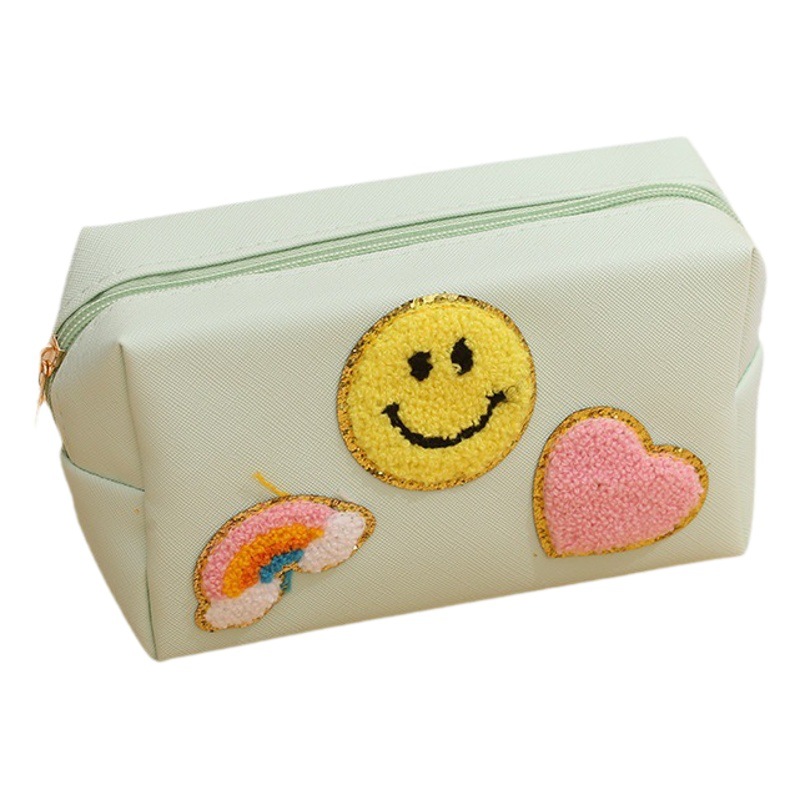 Venta caliente transfronteriza nueva toalla súper popular letras bordadas cara sonriente bolsa de cosméticos mujer bolsa de lavado bolsa de almacenamiento chenille