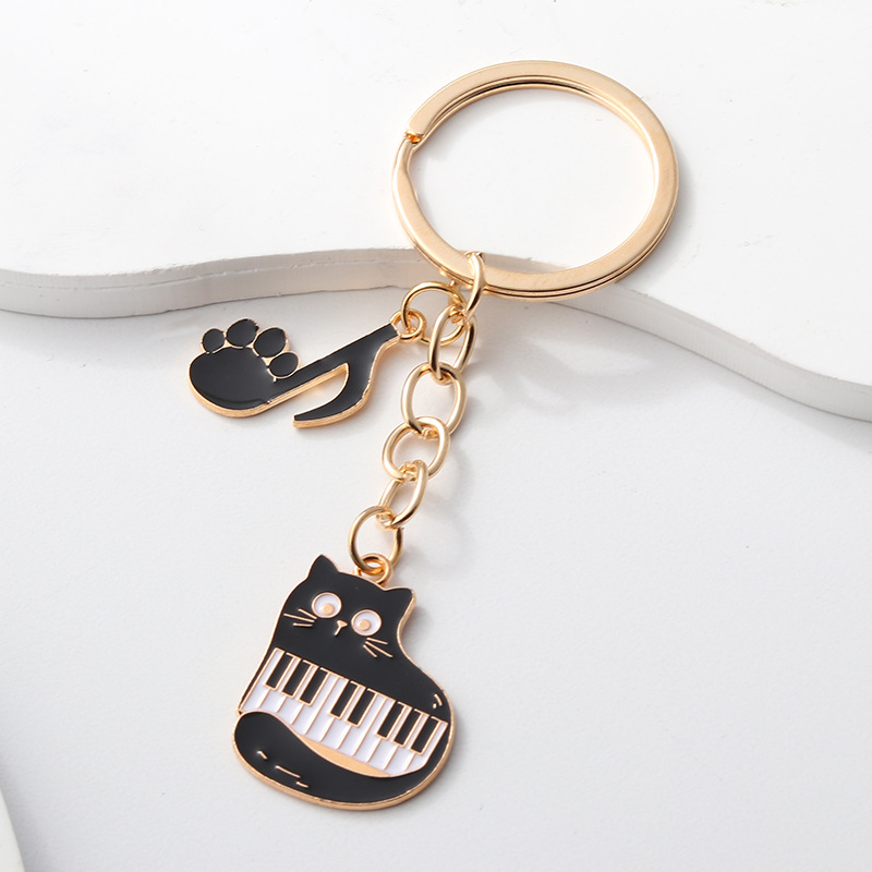 Llavero colgante de instrumento musical con diseño de teclado de violín estilo Chanel, superventas transfronterizo, venta directa de fábrica de Amazon image 16
