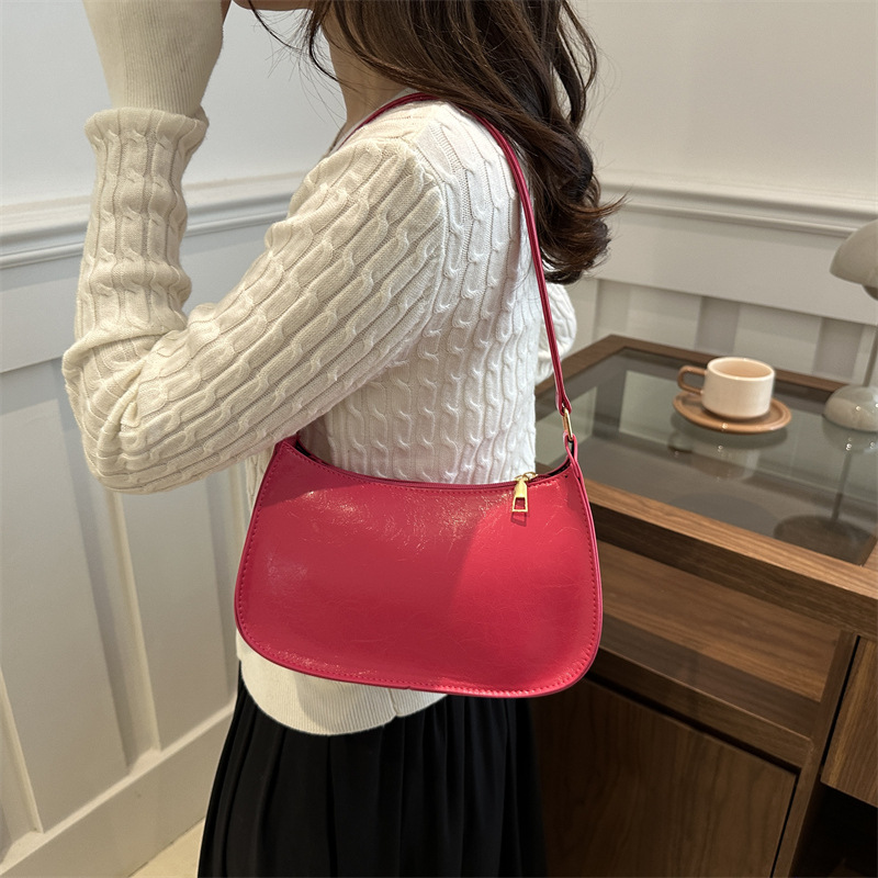 Bolso de sentido de alta gama para mujer 2024 nuevo bolso de palo francés bolso retro portátil para axilas bolso de charol de un solo hombro para niña de estilo occidental