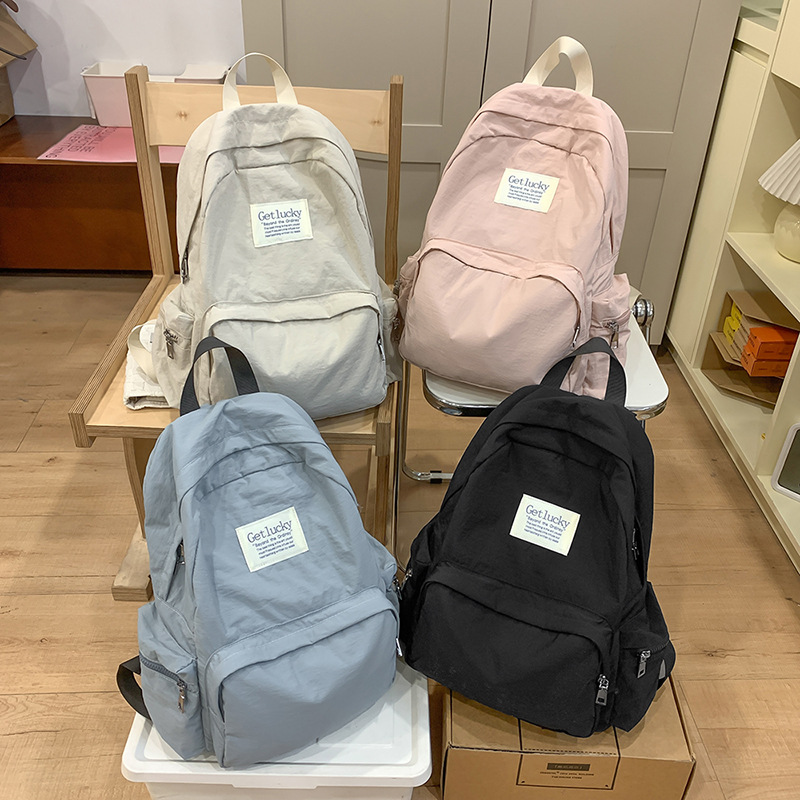 2025 nueva mochila para estudiantes universitarios japoneses, mochila escolar ligera, mochila de viaje simple, impermeable y de gran capacidad