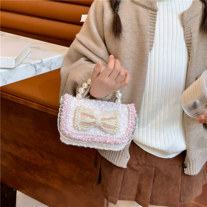 2025 primavera nuevo estilo lentejuelas lazo de perlas niña princesa mano mano accesorios diagonales bolso monedero