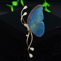 国風の優雅な青い布芸の蝶のブローチの大衆のデザイン感の小さいジルコニアピンのファッションの百合の服の装飾の胸の花