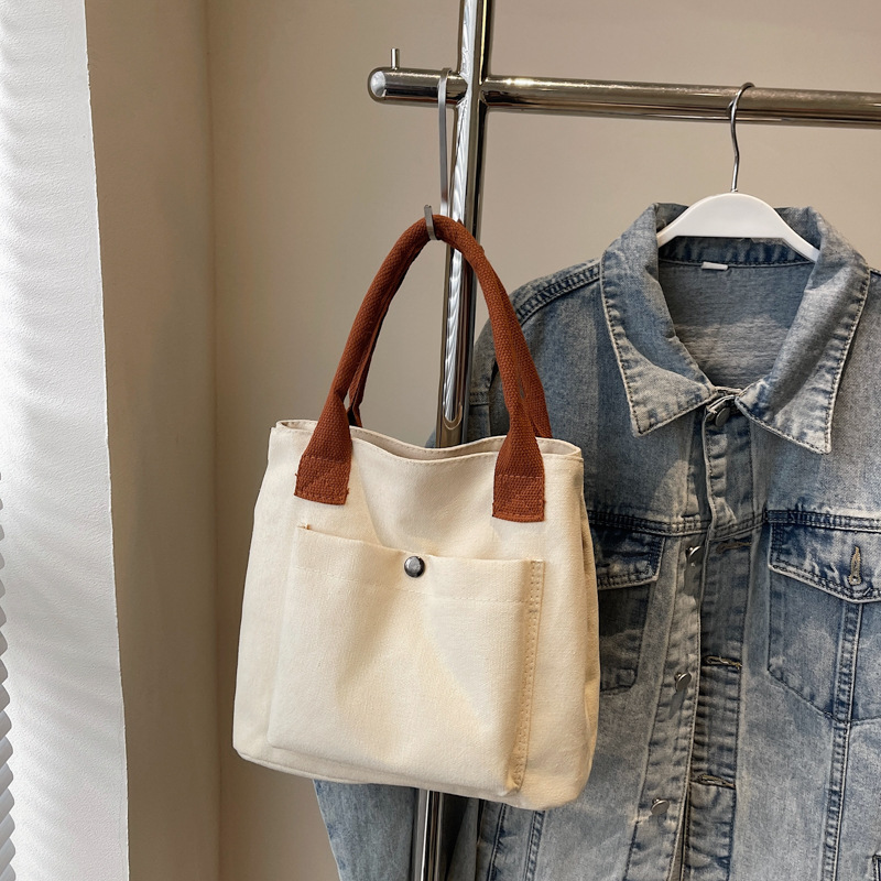 2024 nuevo bolso de lona para mujeres tela japonesa retro simple versátil Harajuku bolso de mano de color sólido casual de moda para mujeres