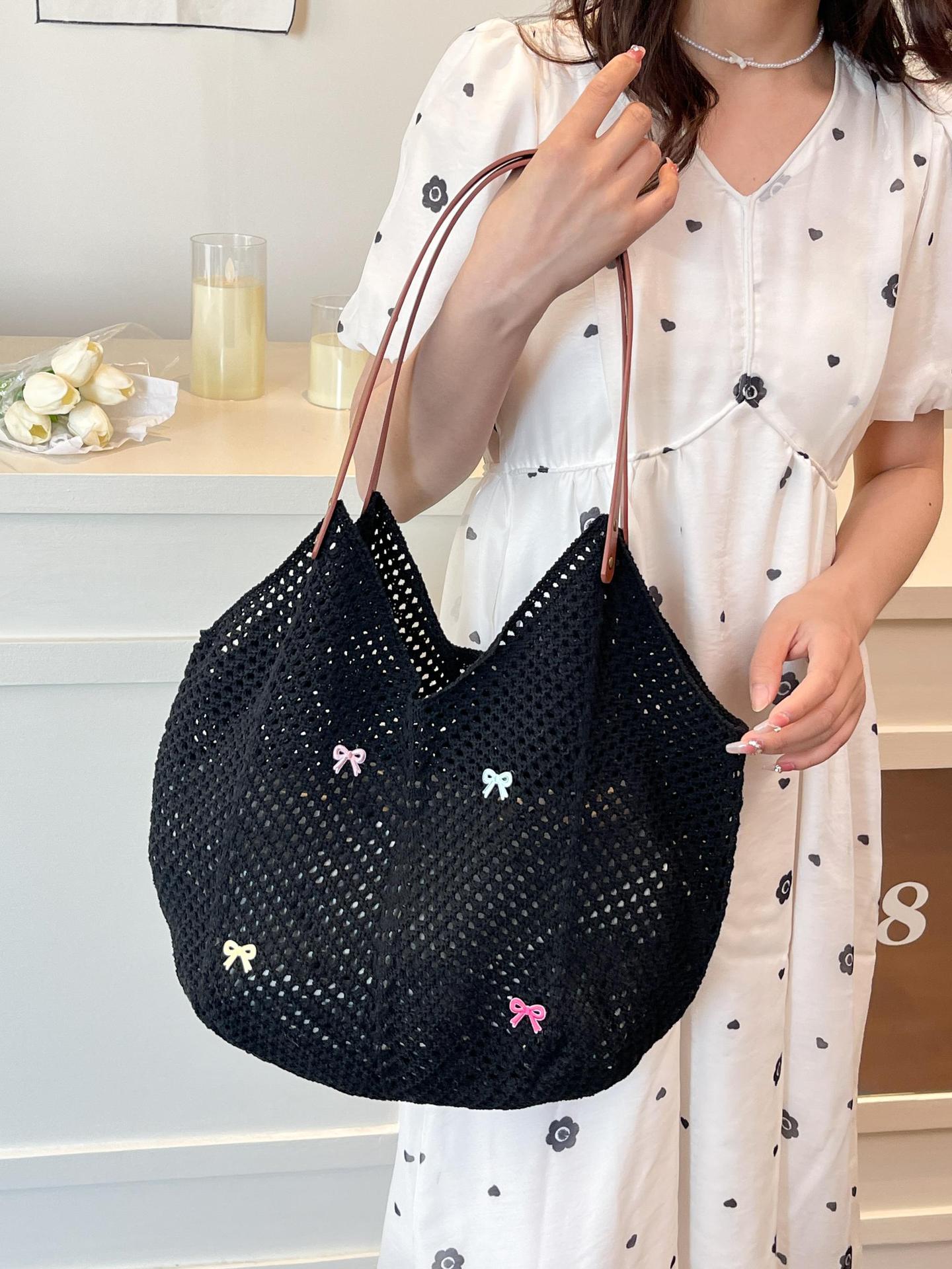 Viaje junto al mar estilo vacaciones bolso de playa tejido hueco mujer 2025 verano nuevo bolso tejido de paja bolso de alta capacidad