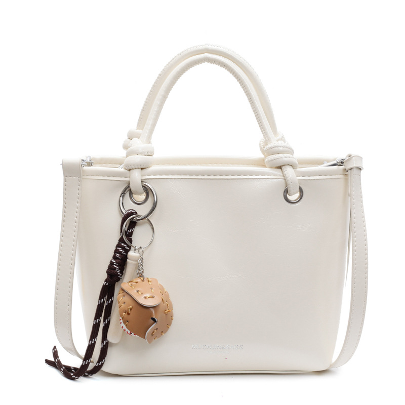 Bolso de mano súper caliente para mujeres 2025 nuevo estilo universal simple de hombro mochila de moda casual bolso de cubo