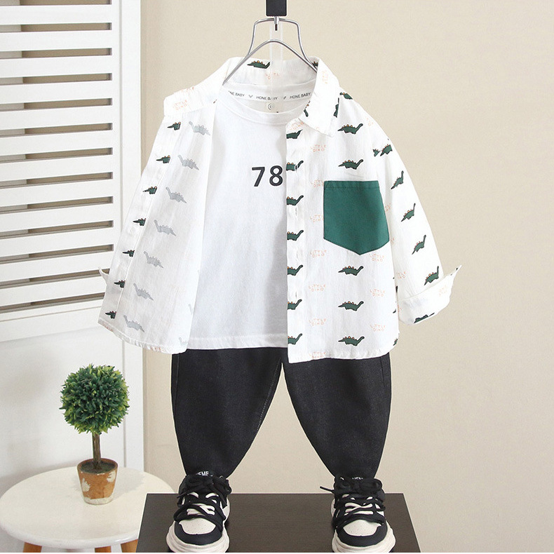 6268 Camisa de dinosaurio de dibujos animados para niños Otoño 2025 Nuevo estilo guapo bebé primavera y otoño Camisa de manga larga para niños