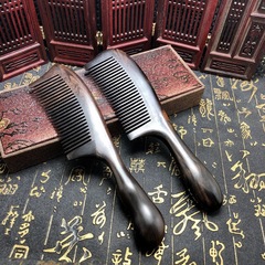 Factory-wholesale premium purple sandalwood comb with mortise-and-tenon joinery, densely spaced teeth, anti-static properties, and a drum-shaped wooden handle—perfect for at-home massage and personal care.