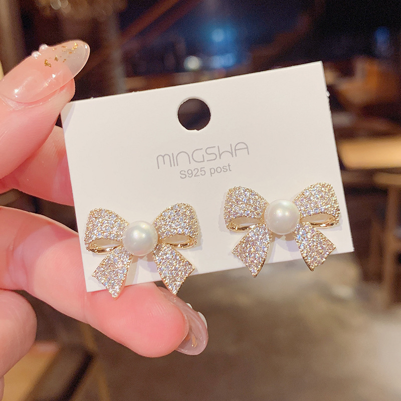 Korean Micro-inlaid Bow Stud Earrings Female Exaggerated Pearl Earrings Wholesale display picture 1