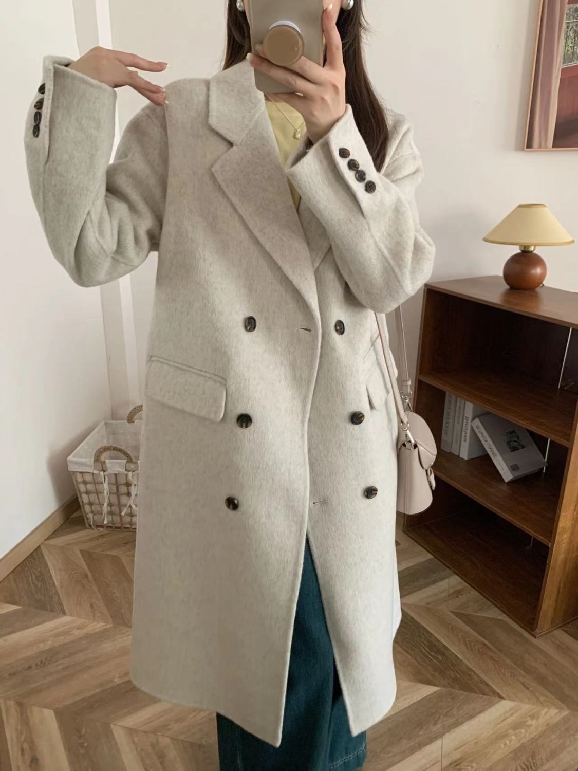 Korean-style double-breasted long over-the-knee wool coat with suit collar, exuding a high-end autumn/winter feel.