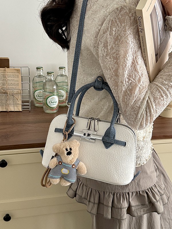 Bolsa de concha de nicho coreano para mujeres 2026 comercio exterior nuevo estilo de alta moda versátil mochila de hombro