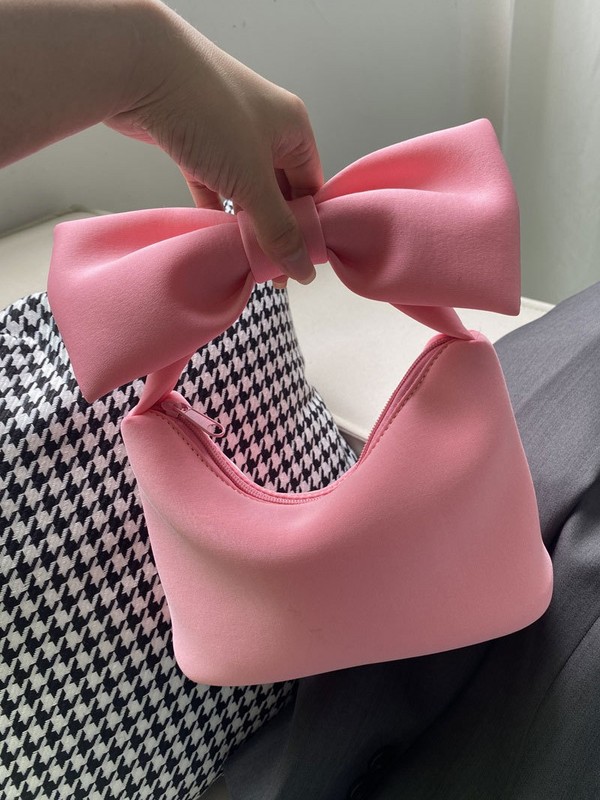 韓国版のかわいい蝶結びのハンドバッグ2025の新型の日本の少女の粉の雲の小さい包みの凹形のデザインのハンドバッグ|undefined