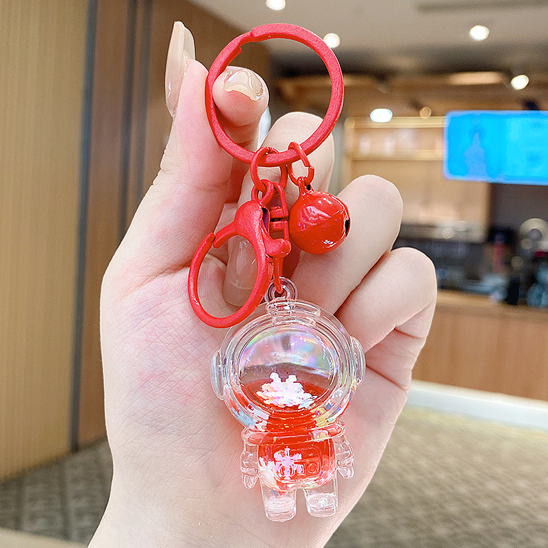 Caricatura en aceite líquido arena flotante botella mochila llavero delicado colgante accesorios accesorios máquina de muñecas pequeños regalos al por mayor