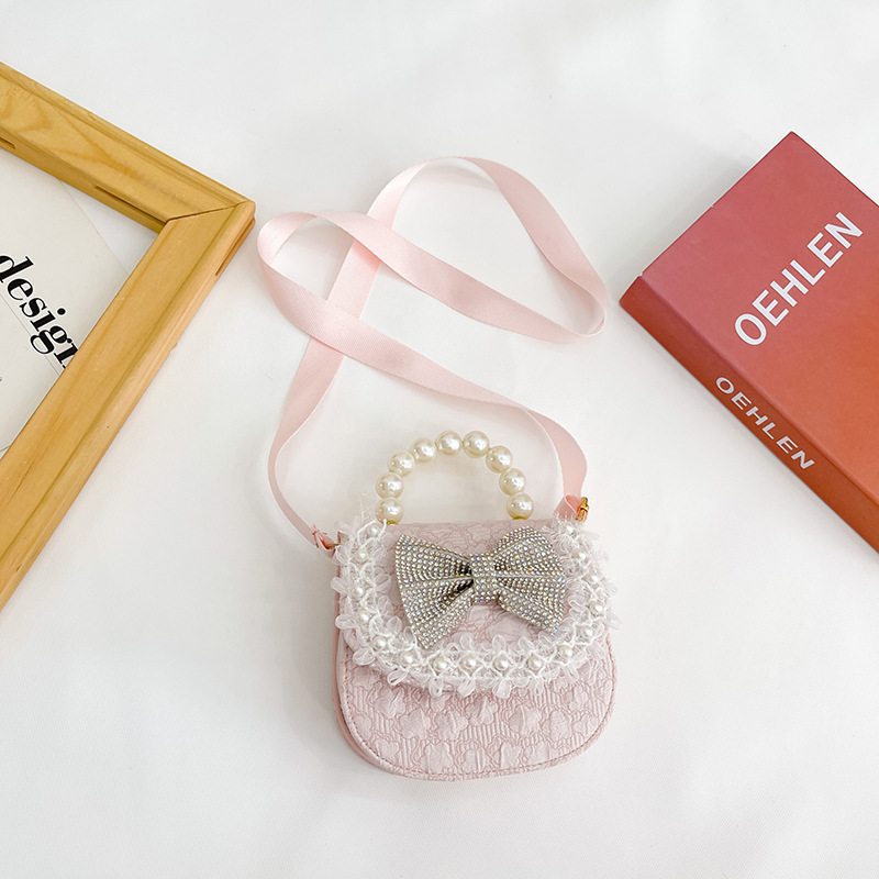 Bolsa de Niños de estilo coreano lindo arco perla Bolso pequeño princesa estilo occidental desgaste a juego joyería bolsa crossbody bolsa