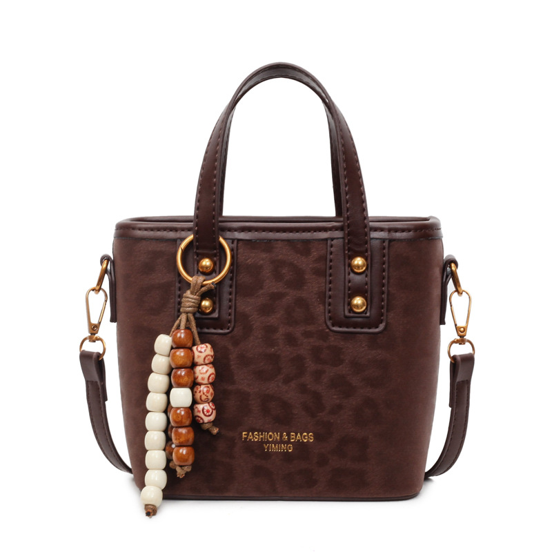 Bolsa de mano con patrón de leopardo transfronterizo, bolsa de cubo de viaje, mujer, otoño y invierno 2025, nueva moda, bolso de hombro de estilo extranjero.