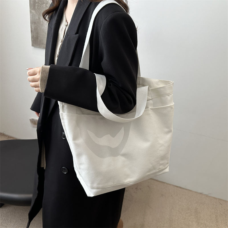 Invierno nuevo paquete de gran capacidad 2024, popular este año bolsas ociosas coreanas, bolsas de hombro de lecciones de reparación