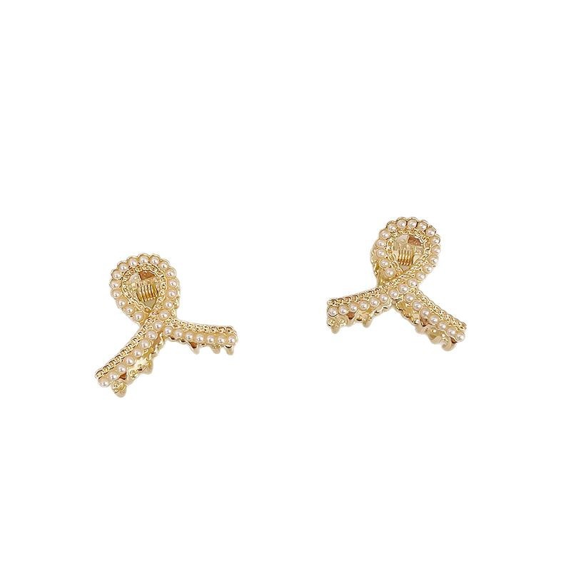 Pequeñas pinzas de cabello de perla temperamento feminino medio agarrado pinzas de cabello de borde pequeño adornamiento de cabeza de alto nivel no lastimar pinzas de cabello