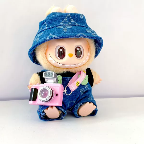 Blue suspenders, hat, camera, four-leaf clover
