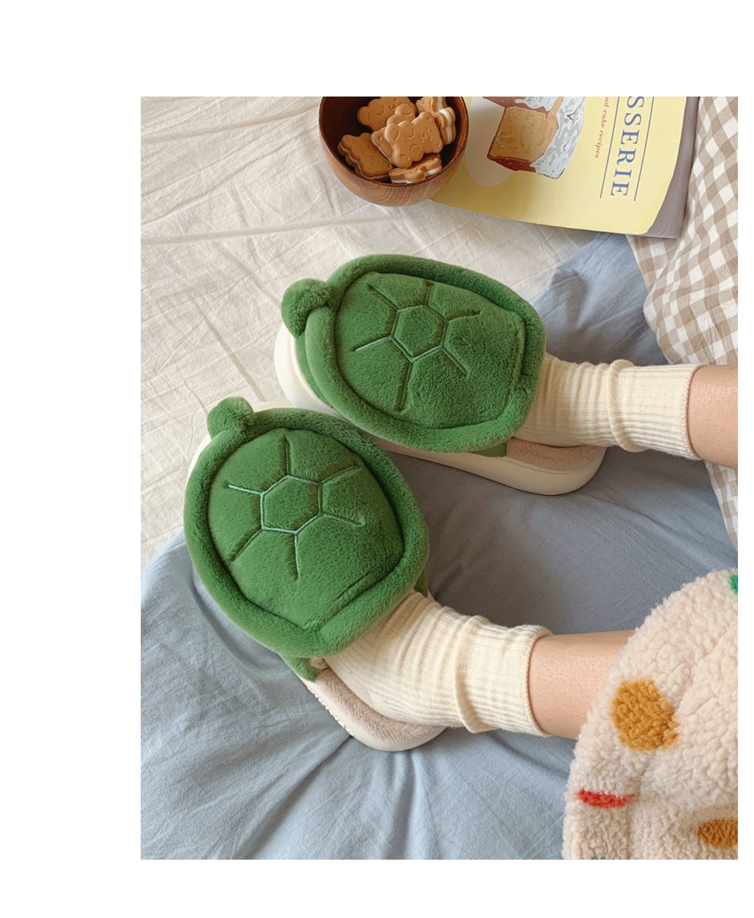 Green turtle-shaped slippers on feet from a high angle