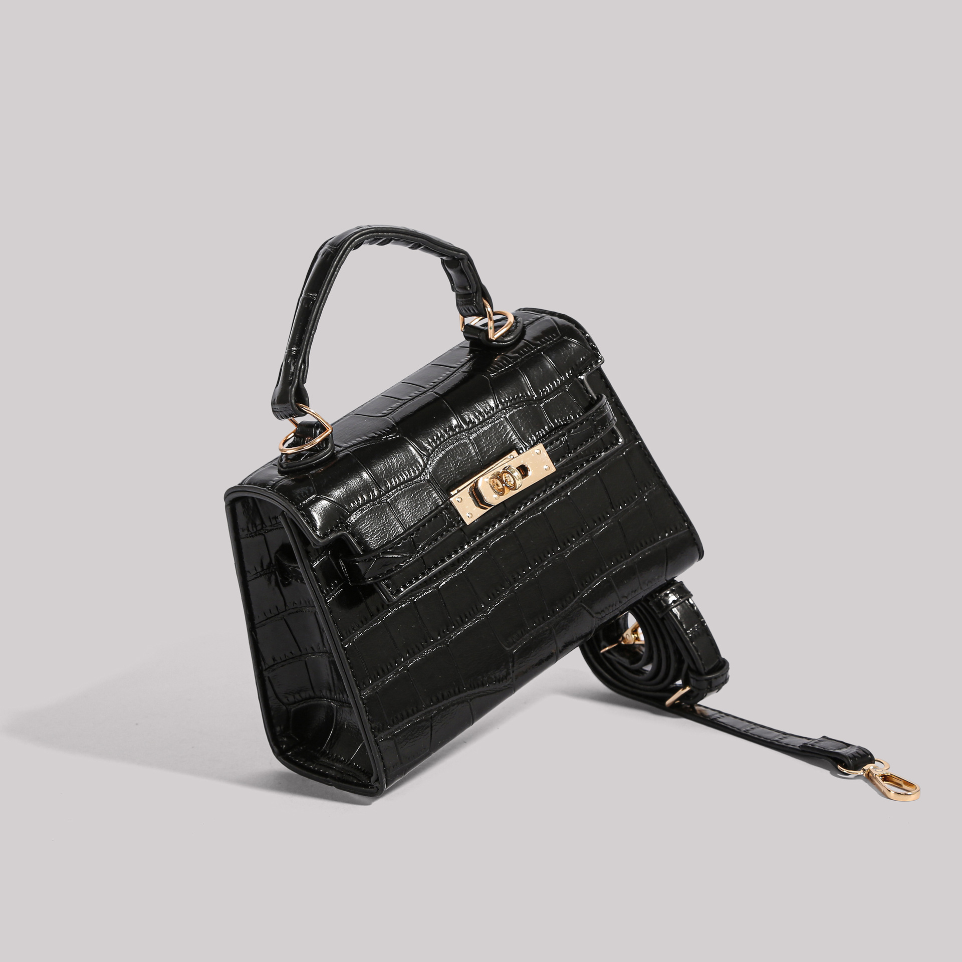 Los fabricantes venden directamente el nuevo bolso Kelly simple en 2025 con un bolso cuadrado pequeño y un bolso con patrón de cocodrilo.