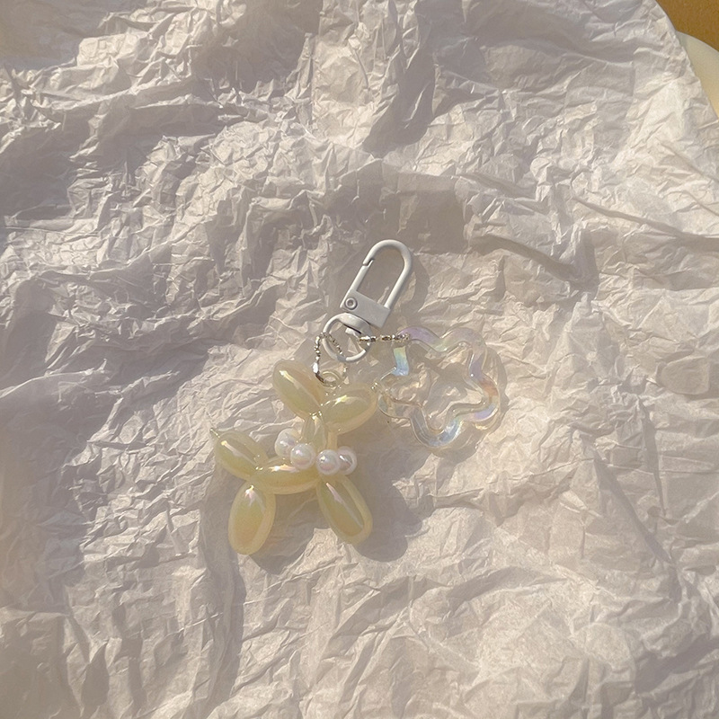 Pequeño Libro Rojo mismo lindo jalea globo láser perro llavero colgante colorido cachorro de dibujos animados teléfono llavero