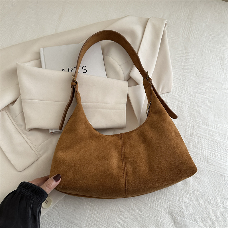 Nuevo diseño de nicho bolso de axila de piel de vaca otoño e invierno bolso de mensajero casual de un solo hombro bolso de baguette de moda para mujer