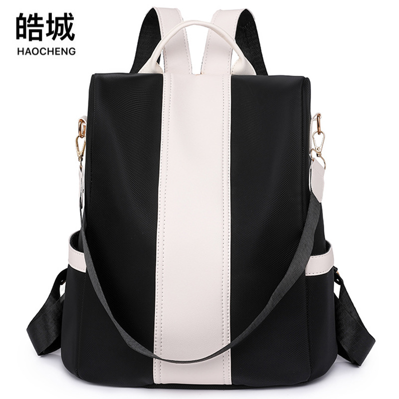 Bolso mujer 2023 nueva mochila de nailon para mujer coreana simple y versátil mochila de color de contraste ligero al aire libre al por mayor