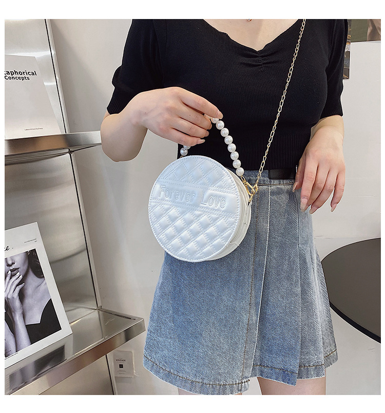 Fashion Solid Color Embossed Pearl Handle Small Round Bag display picture 12